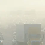 Lahore school children wearing masks and attending indoor assembly due to severe smog crisis and new school timings implementation